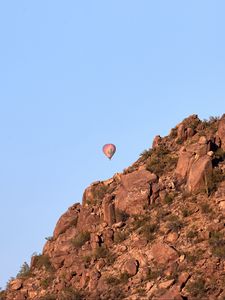 Preview wallpaper balloon, rock, mountains, sky