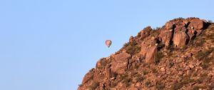 Preview wallpaper balloon, rock, mountains, sky