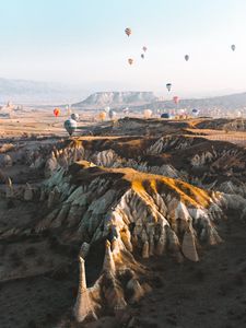 Preview wallpaper balloons, colorful, mountains, rocks, valley