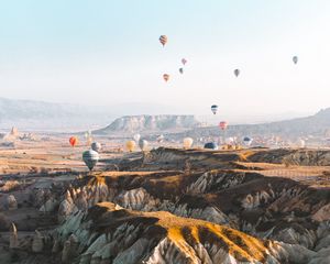 Preview wallpaper balloons, colorful, mountains, rocks, valley