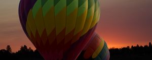 Preview wallpaper balloons, colorful, trees, sunset