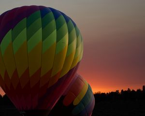 Preview wallpaper balloons, colorful, trees, sunset