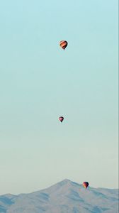 Preview wallpaper balloons, mountains, rocks, flight
