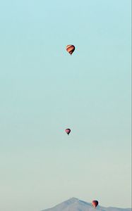 Preview wallpaper balloons, mountains, rocks, flight
