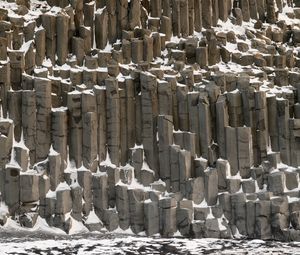 Preview wallpaper basalt columns, columns, stone, snow