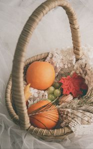 Preview wallpaper basket, fruit, leaves, feather