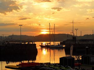 Preview wallpaper bay, boats, mountains, reflection, sunset, clouds