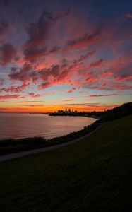 Preview wallpaper bay, coast, sea, buildings, silhouettes, sunrise