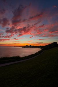 Preview wallpaper bay, coast, sea, buildings, silhouettes, sunrise