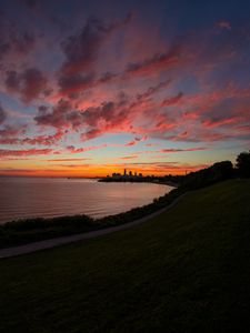 Preview wallpaper bay, coast, sea, buildings, silhouettes, sunrise