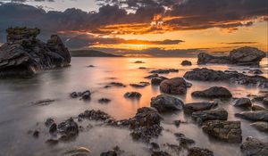 Preview wallpaper bay, sunset, horizon, stones, clouds
