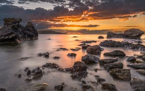 Preview wallpaper bay, sunset, horizon, stones, clouds