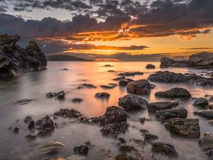 Preview wallpaper bay, sunset, horizon, stones, clouds