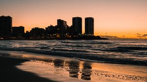 Preview wallpaper beach, city, buildings, sea, dusk, dark