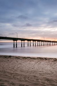 Preview wallpaper beach, coast, sea, bridge, twilight