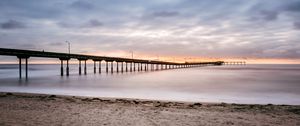 Preview wallpaper beach, coast, sea, bridge, twilight