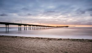 Preview wallpaper beach, coast, sea, bridge, twilight