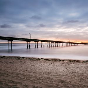 Preview wallpaper beach, coast, sea, bridge, twilight