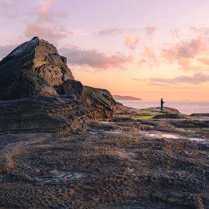 Preview wallpaper beach, coast, silhouette, rock, sea