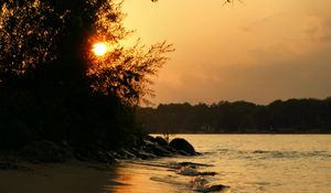 Preview wallpaper beach, coast, sunset, sea, glare