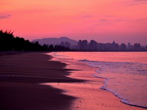 Preview wallpaper beach, dusk, sea, coast, city