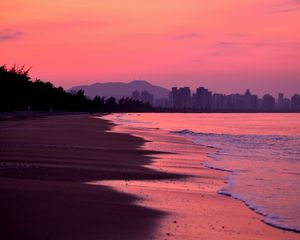 Preview wallpaper beach, dusk, sea, coast, city