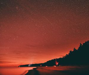 Preview wallpaper beach, dusk, starry sky, dark, red