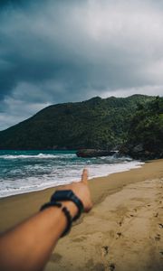 Preview wallpaper beach, hand, rocks, sea, waves