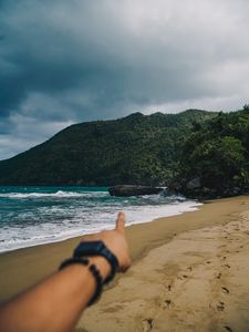 Preview wallpaper beach, hand, rocks, sea, waves