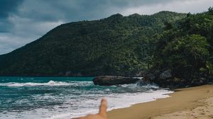 Preview wallpaper beach, hand, rocks, sea, waves