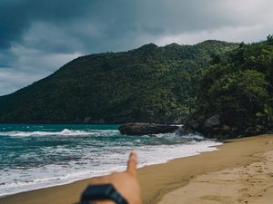 Preview wallpaper beach, hand, rocks, sea, waves