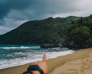 Preview wallpaper beach, hand, rocks, sea, waves