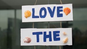 Preview wallpaper beach, inscription, words, shells, signboard