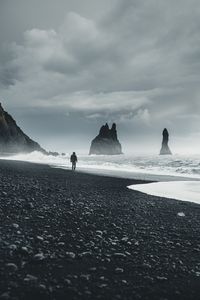 Preview wallpaper beach, man, sea, waves, rocks