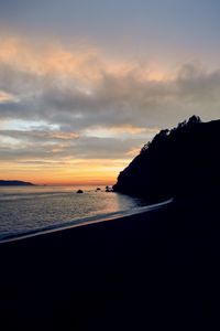 Preview wallpaper beach, mountains, sea, sunset, silhouettes, dark