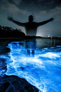 Preview wallpaper silhouette, night, water, luminescence, glow