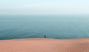 Preview wallpaper beach, ocean, silhouette, sand, haze, horizon