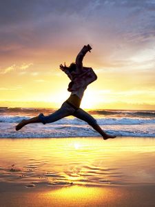 Preview wallpaper beach, people, jump, sunset, sea