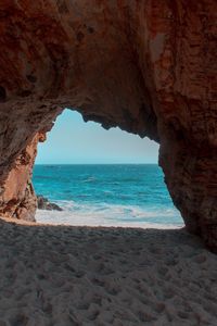 Preview wallpaper beach, rock, cave, sea, sand, water