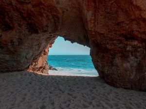 Preview wallpaper beach, rock, cave, sea, sand, water