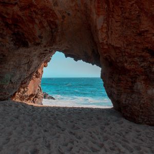 Preview wallpaper beach, rock, cave, sea, sand, water