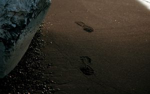 Preview wallpaper beach, rocks, sand, footprints