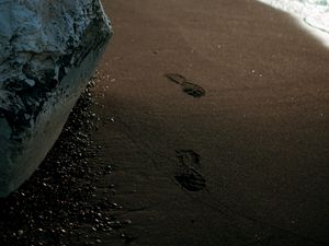 Preview wallpaper beach, rocks, sand, footprints