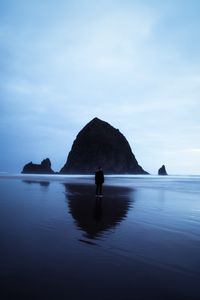 Preview wallpaper beach, rocks, sea, man, loneliness