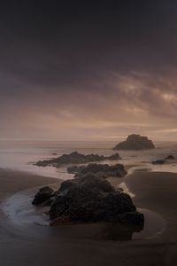 Preview wallpaper beach, rocks, sea, landscape, twilight