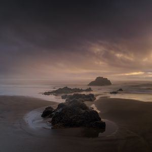 Preview wallpaper beach, rocks, sea, landscape, twilight