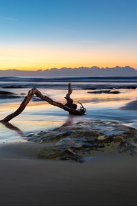 Preview wallpaper beach, sand, sea, log, landscape