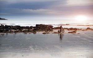 Preview wallpaper beach, sand, stones, cyclist, walk
