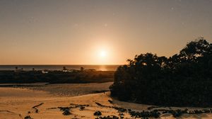Preview wallpaper beach, sand, sunset, twilight, sun, horizon, bushes