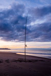 Preview wallpaper beach, sea, fishing rod, fishing, twilight